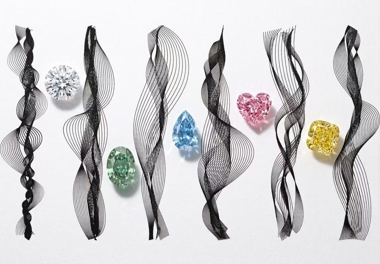 White, green, blue, pink and yellow diamonds with sculptural black ribbons